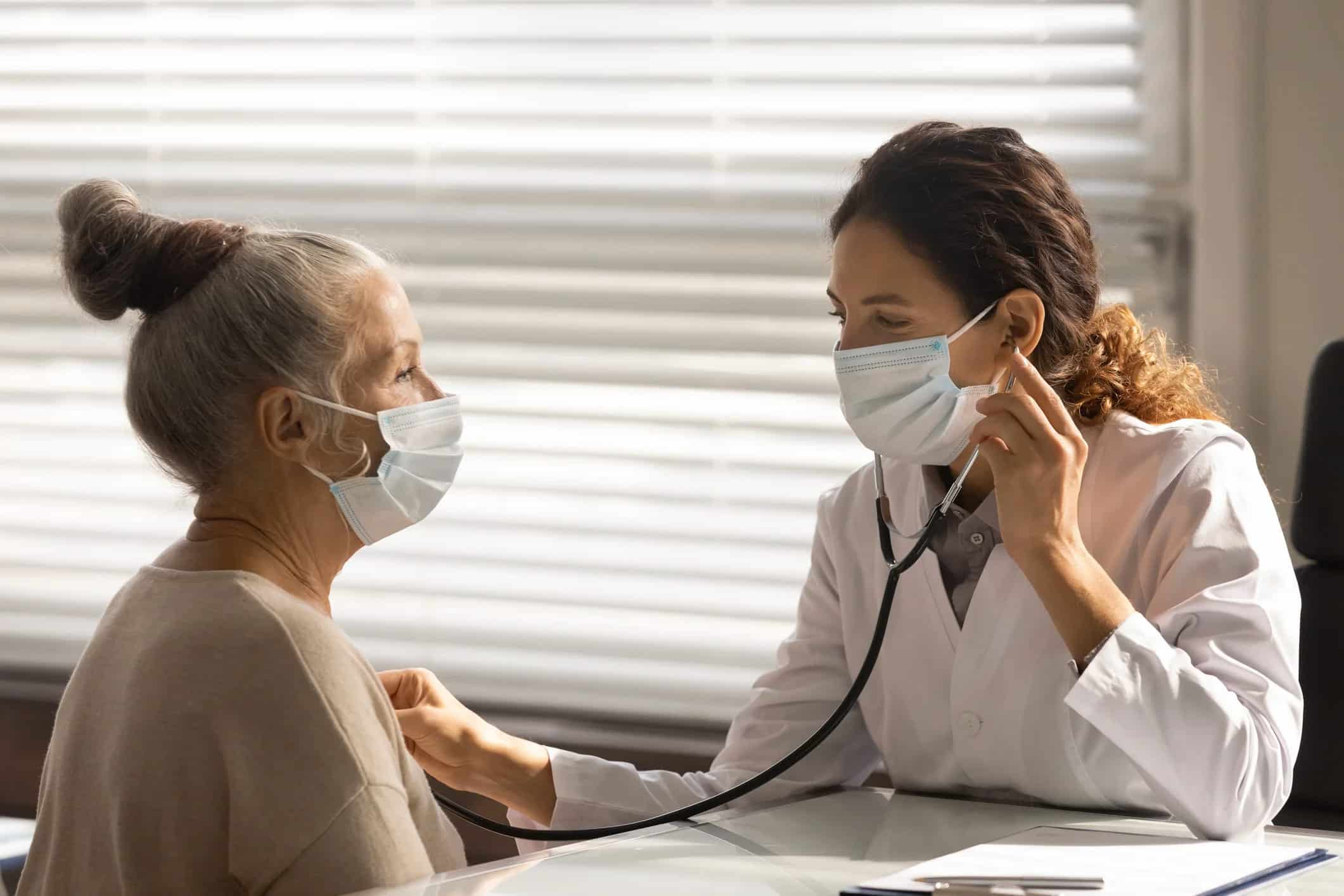 doctor and patient with masks on