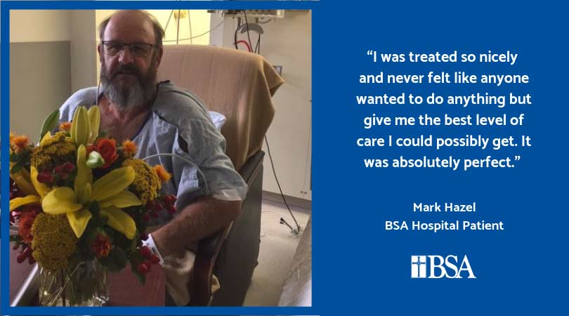 man in hospital with flowers