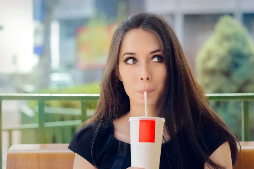 woman drinking soda