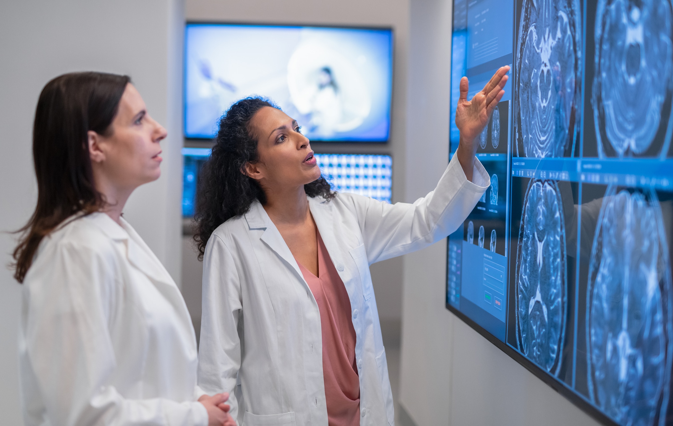 woman looking at a brain scan