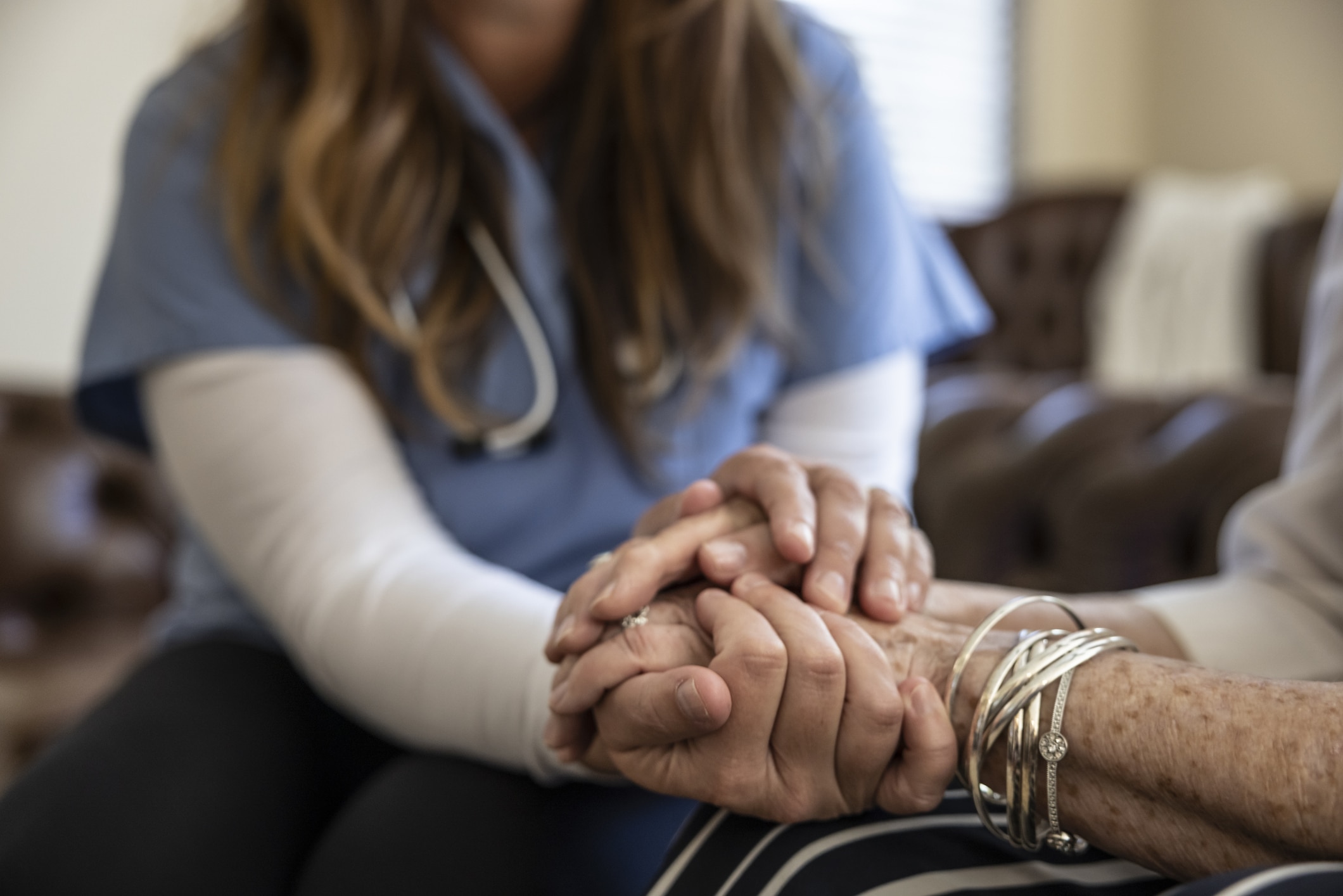 doctor holding a patient's hand