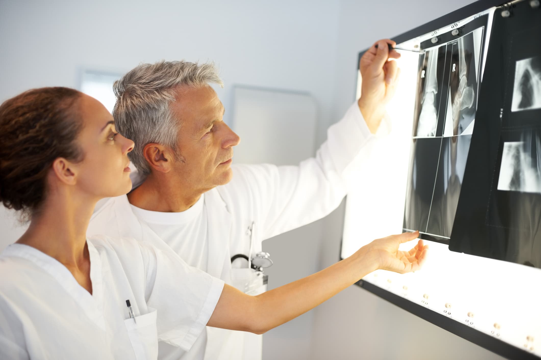 two people looking at an xray