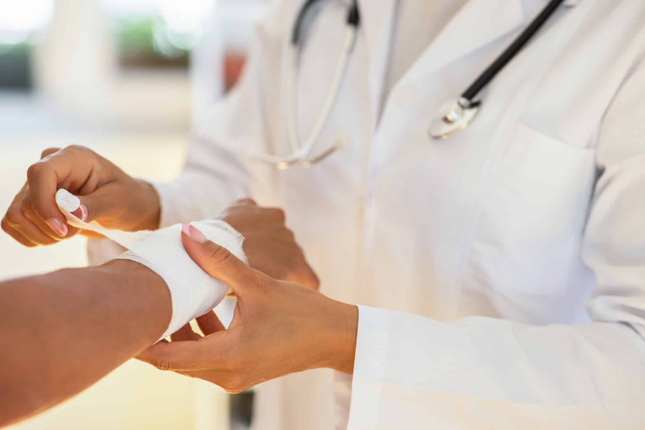 doctor bandaging a wrist